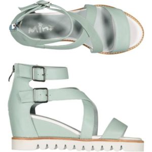 a lovely light green mint leather sandal - ankle strap with buckles. Sitting on a wedge sole unit.